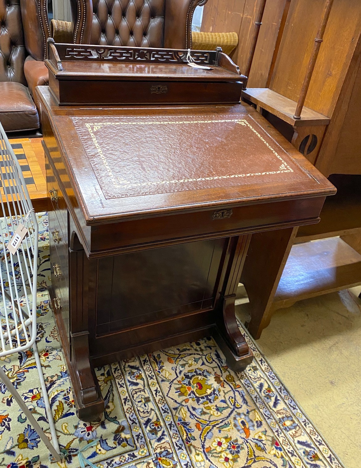 A late Victorian mahogany Davenport, width 56cm, depth 56cm, height 92cm